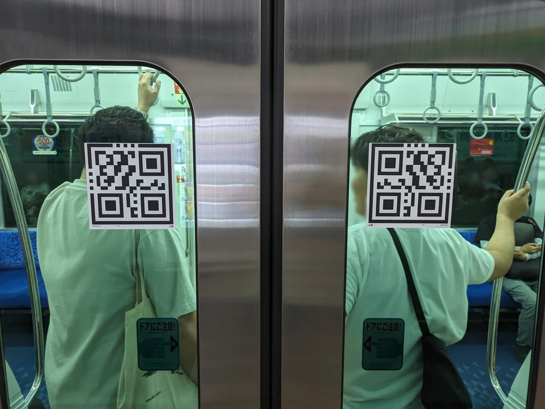 What do these QR code-like symbols on the train doors do? I assume it's ...