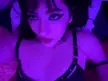 Slim Asian egirl in black lingerie posing facedown ass up under purple lighting