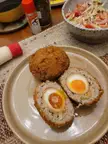 [Homemade] Japanese style scotch eggs. Gyoza filling and ramen eggs, panko crumbed and deep fried.