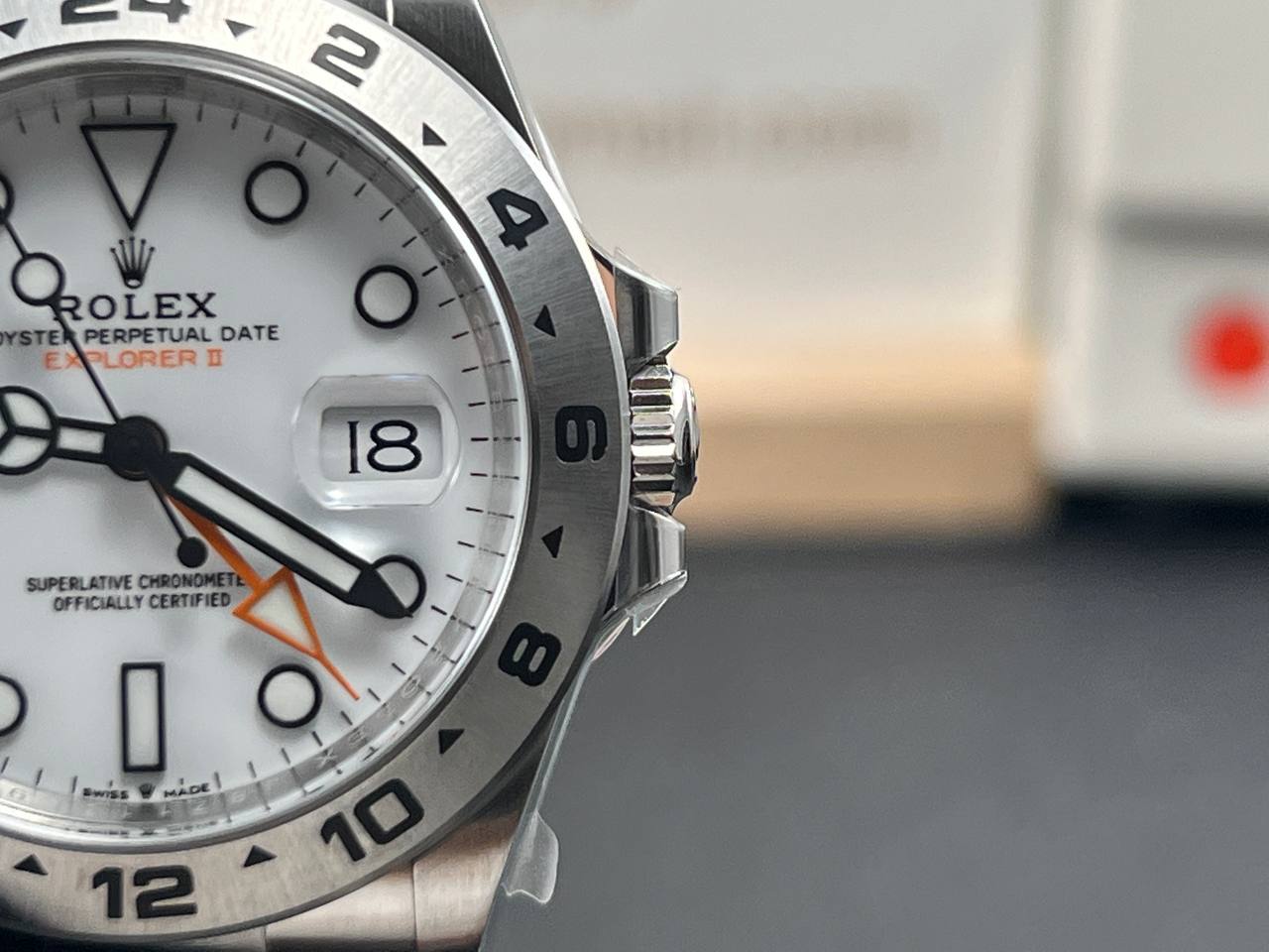 Close-up and back view of a Rolex Explorer II 226570 with a white dial.