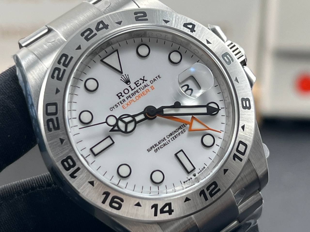 Close-up and back view of a Rolex Explorer II 226570 with a white dial.