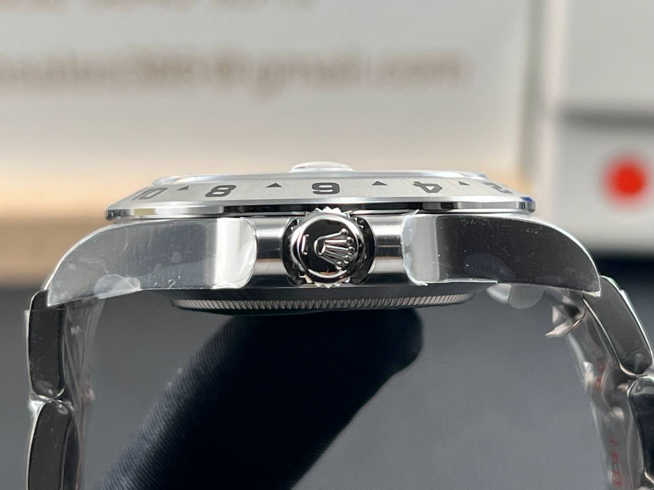 Close-up and back view of a Rolex Explorer II 226570 with a white dial.