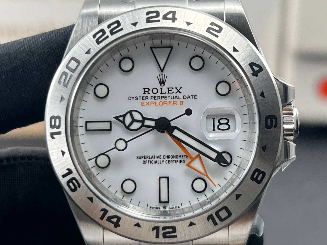 Close-up and back view of a Rolex Explorer II 226570 with a white dial.