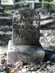 Homemade cement headstone from a forgotten plot behind a Buccees