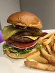 Double cheeseburger. Farm shop butcher’s beef, ground to order, and smoked streaky bacon. Cooked over charcoal and stacked with all the fixings.