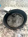 Melted oil residue on cast iron