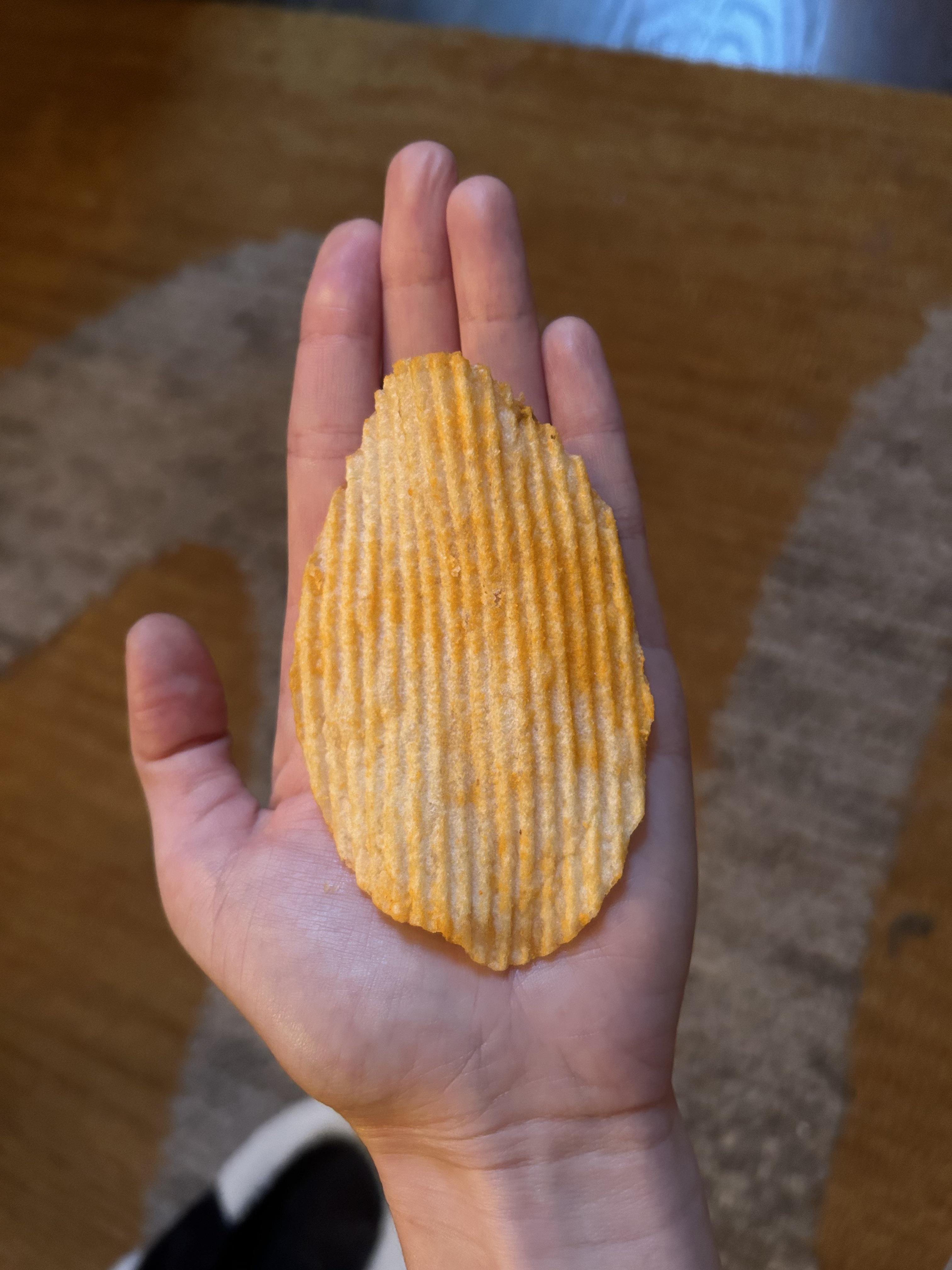 The size of this Ruffle chip compared to my hand | Scrolller