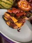 Triple Oklahoma Smash Burgers with sauteed jalepenos and Bacon from a Blackstone griddle. Trader Joe's brioche buns!
