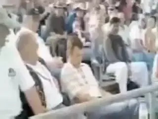 Guy falls asleep in the stadium