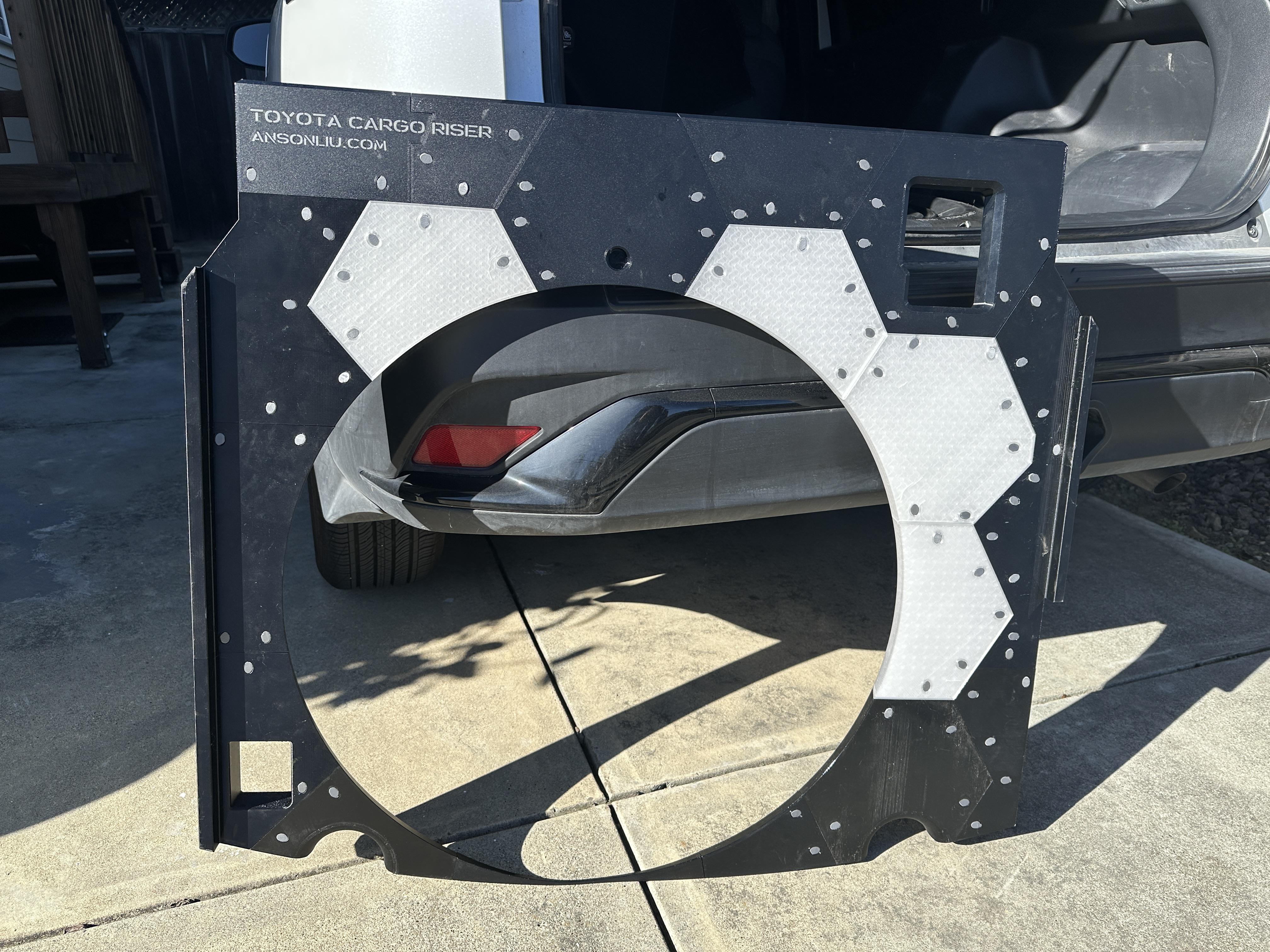 I created a spare tire holder and cargo riser for my hybrid car that ...
