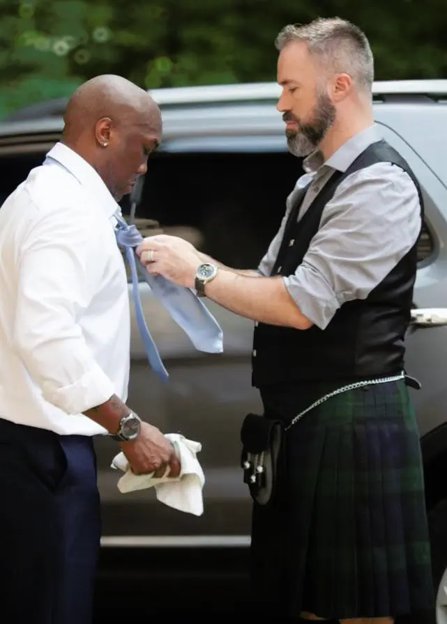 Helping the groom with his tie