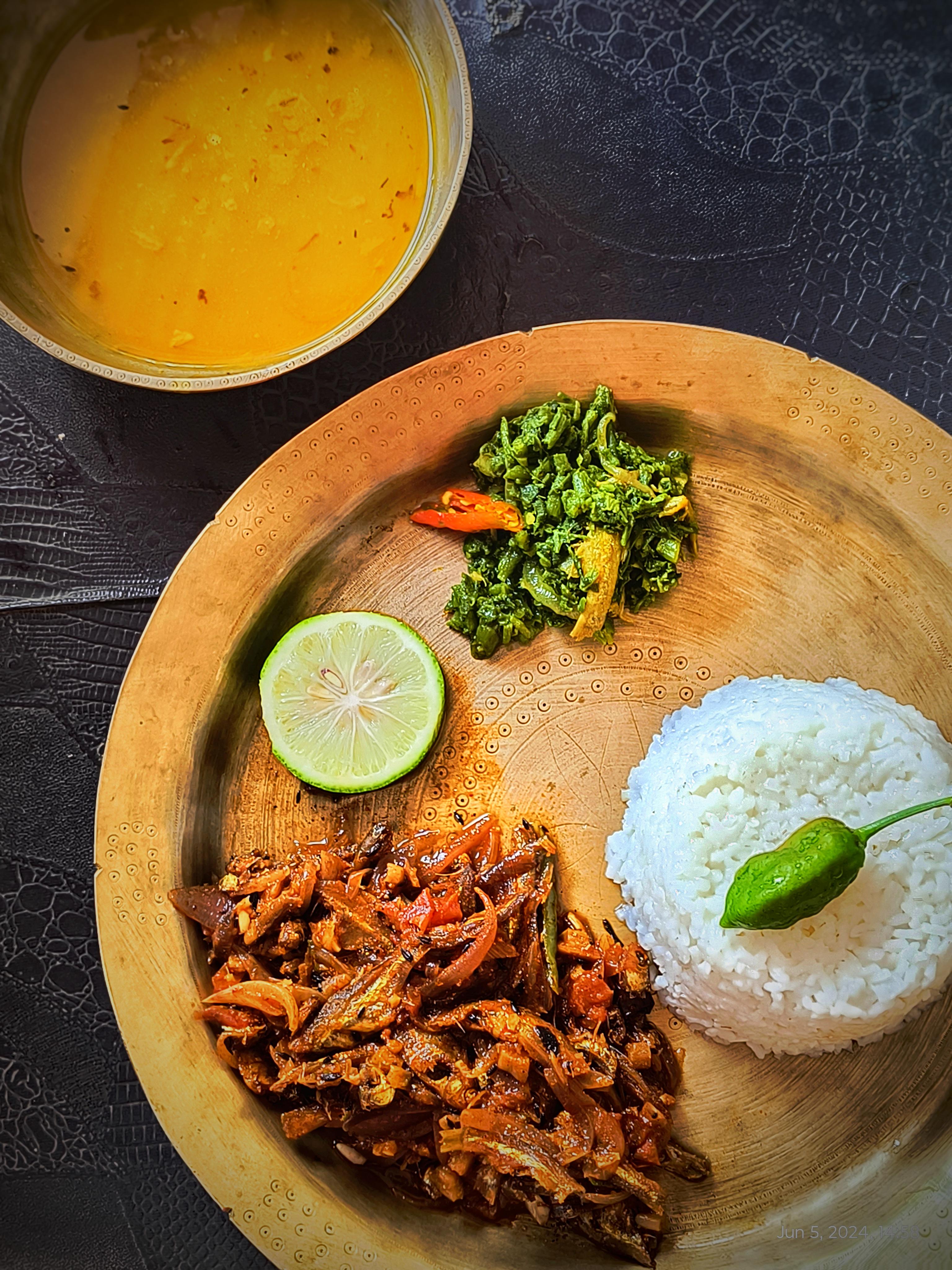 Homemade Assamese thali consisting dried fish cooked with fresh bamboo ...