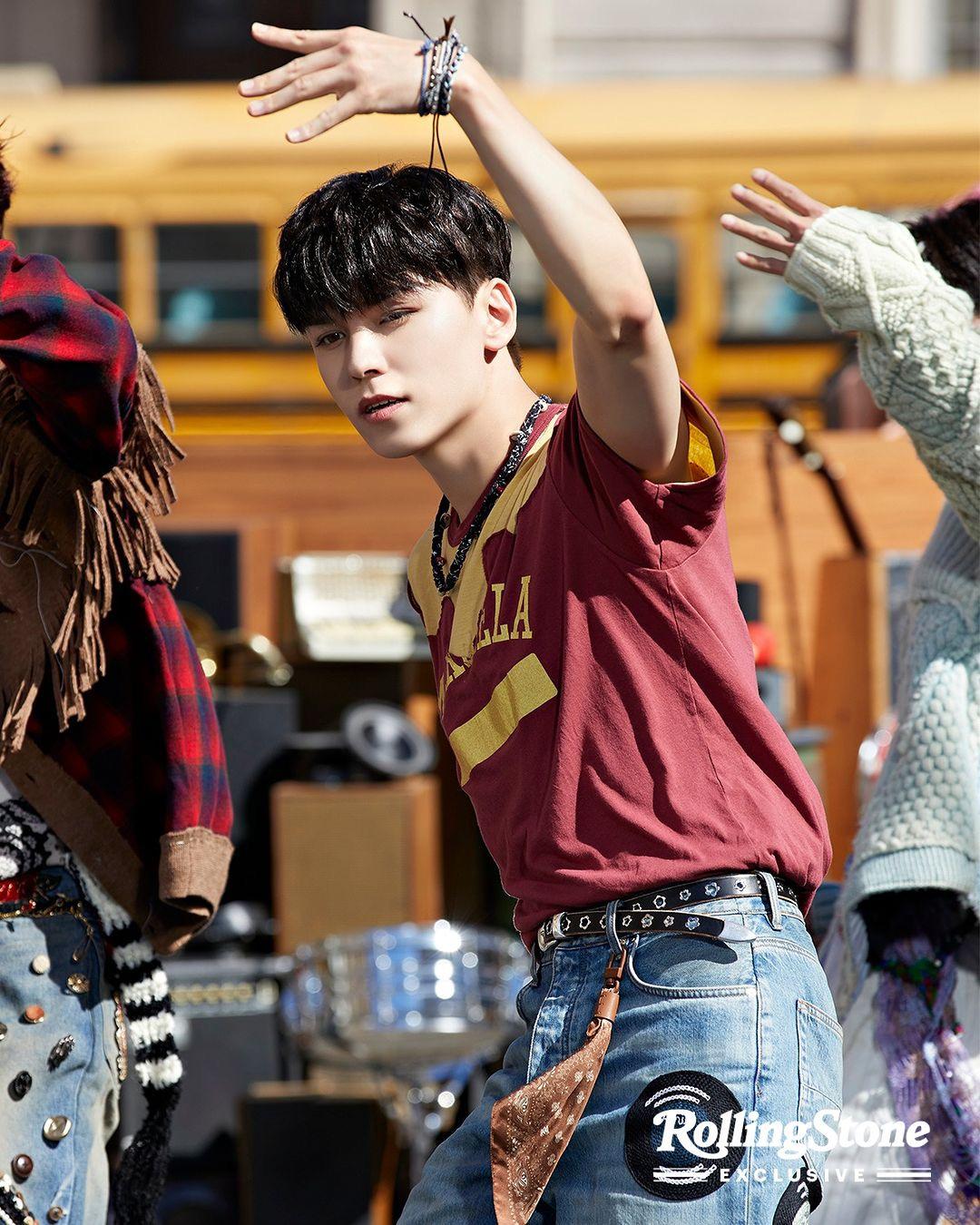 SEVENTEEN kpop idols in 2000s style streetwear, wearing cardigans, ripped blue denim jeans, and colorful knitwear.