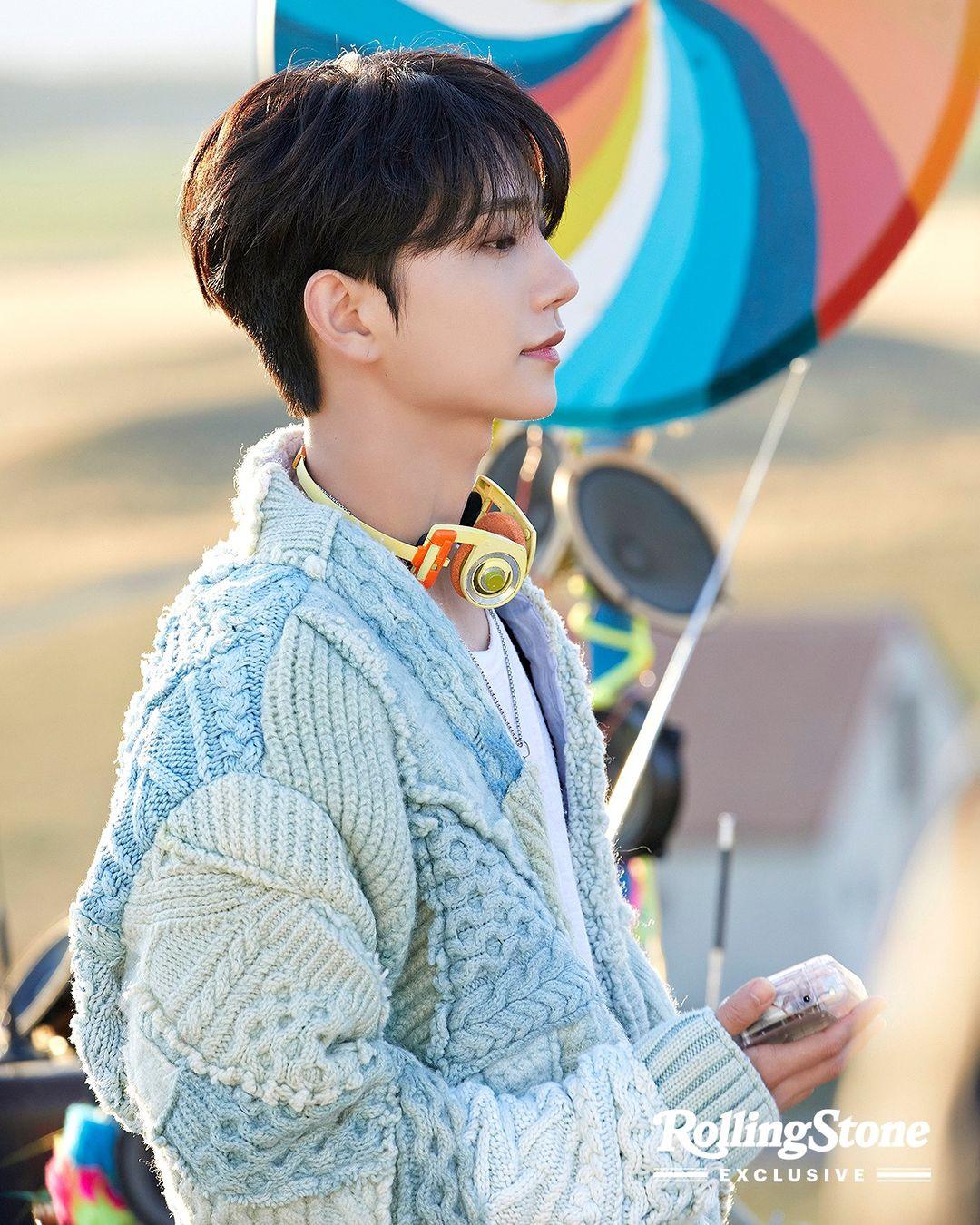 SEVENTEEN kpop idols in 2000s style streetwear, wearing cardigans, ripped blue denim jeans, and colorful knitwear.