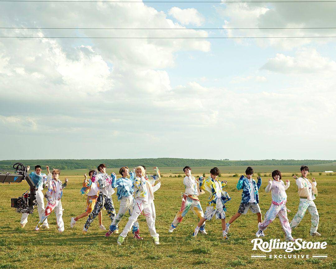 SEVENTEEN kpop idols in 2000s style streetwear, wearing cardigans, ripped blue denim jeans, and colorful knitwear.