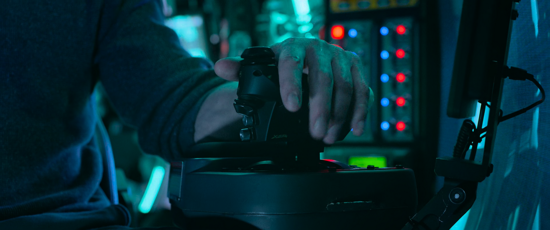 In The Meg (2018), they used a Saitek Pro Flight X-55 throttle control. They didn't even bother to scratch out the model #