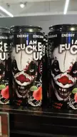 Jonkler energy drink cans with a scary clown face and profanity on a store shelf