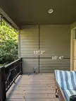 Is there any way it's safe to have a natural gas grill on this covered deck? We have this gas line here but it just seems like there would be no safe place to actually put a grill. The siding is Hardie Board, and the deck is Trex, but the railing is wood and the ceiling is plywood.
