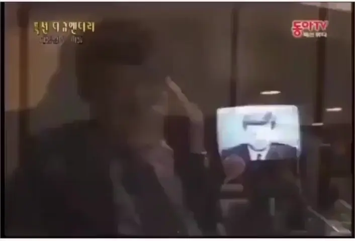 JFK JR watches a video of his father 