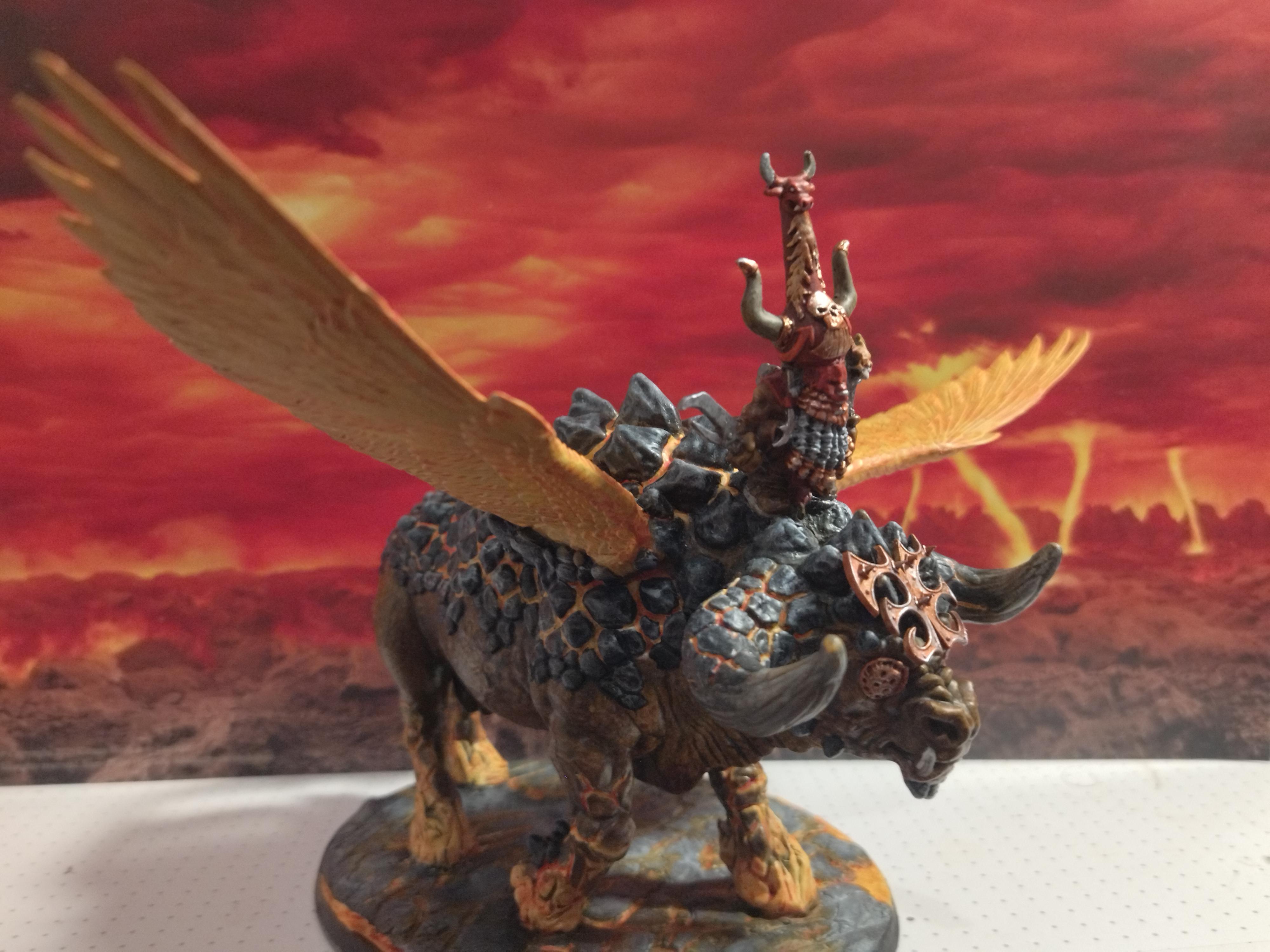 Sorcerer Lord on Great Taurus Warhammer miniature with an armored rider on a winged creature against a volcanic backdrop
