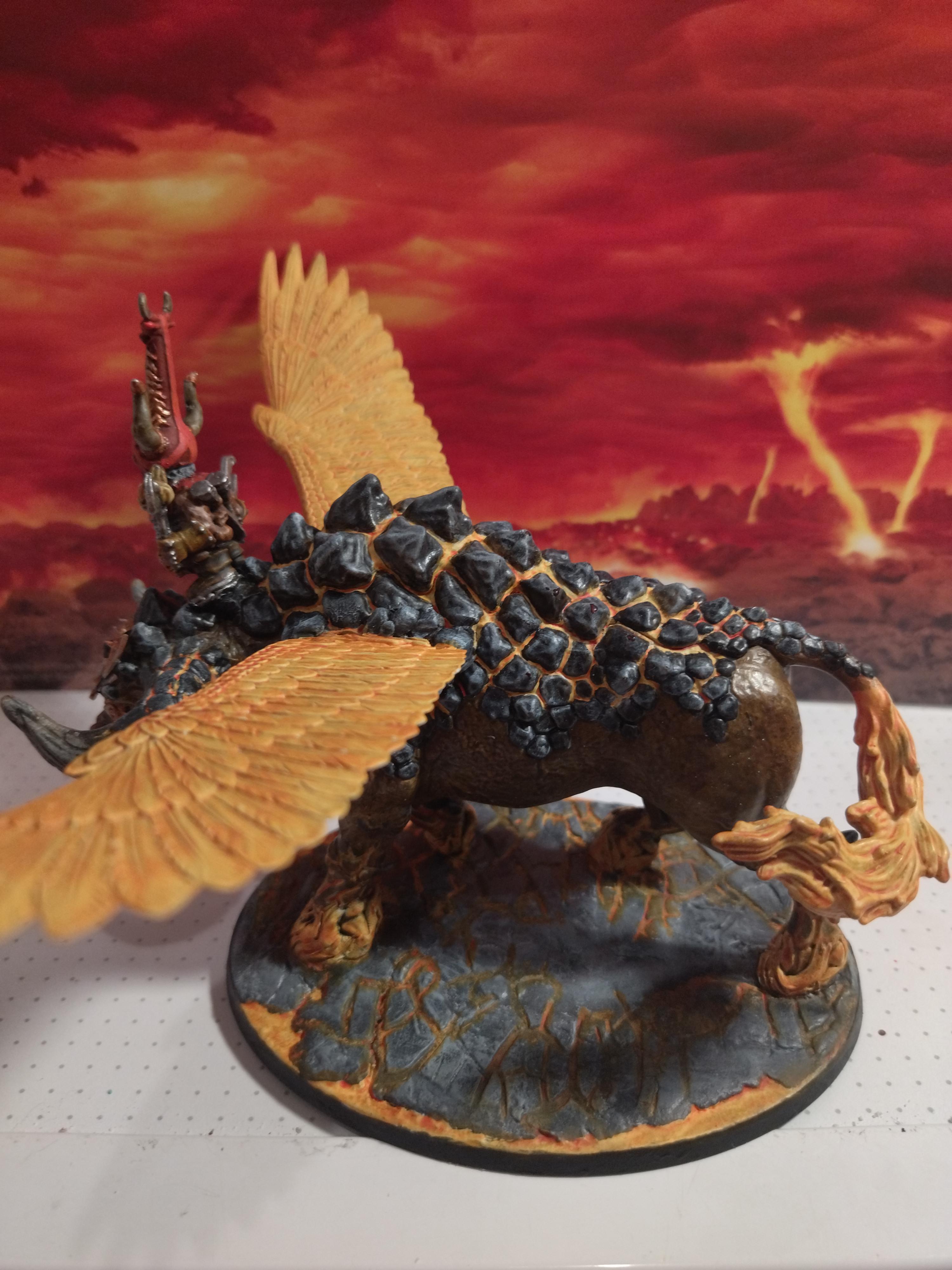 Sorcerer Lord on Great Taurus Warhammer miniature with an armored rider on a winged creature against a volcanic backdrop