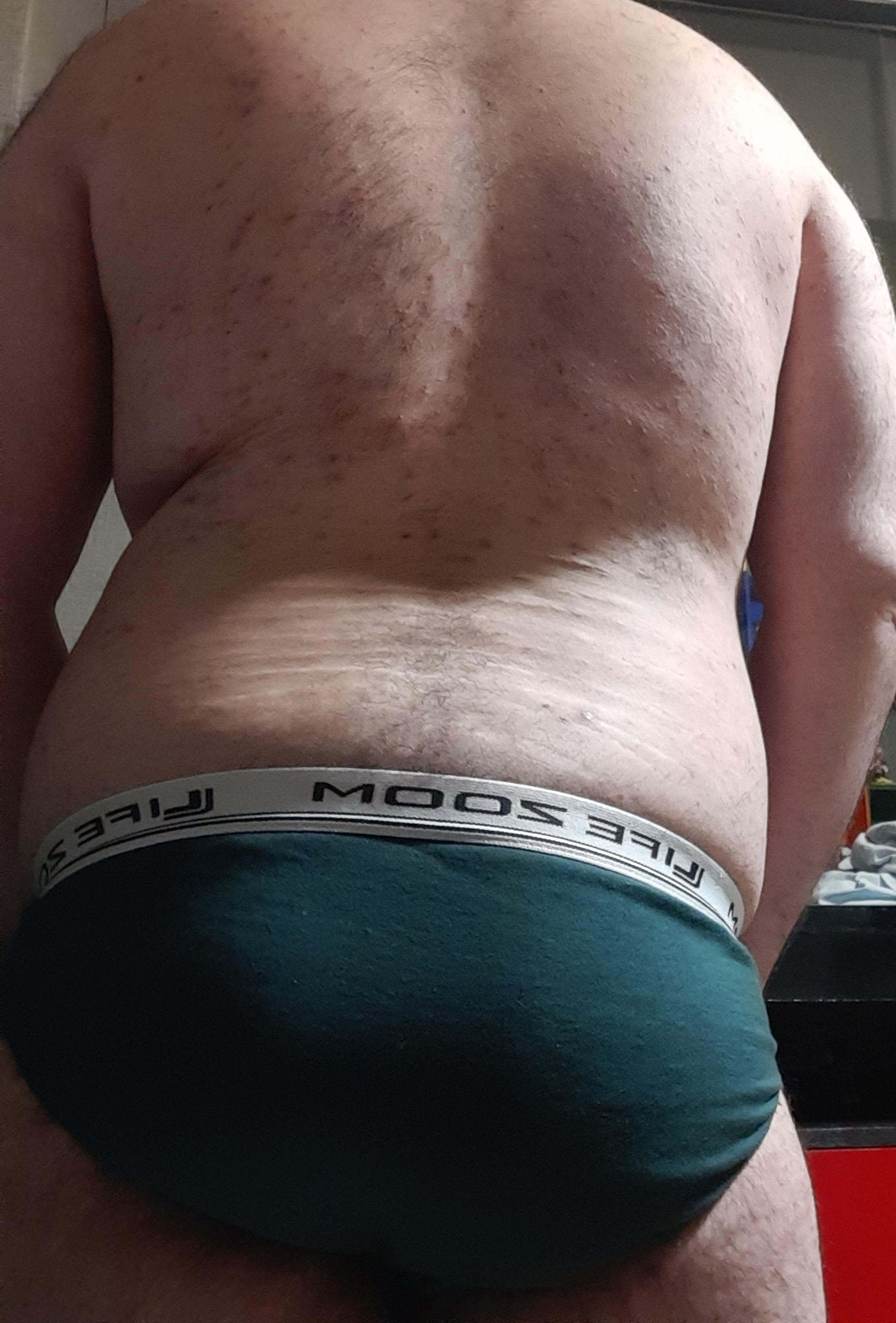 rian_harper in dark green underwear, front and back body shots showing a dad bod and small dick