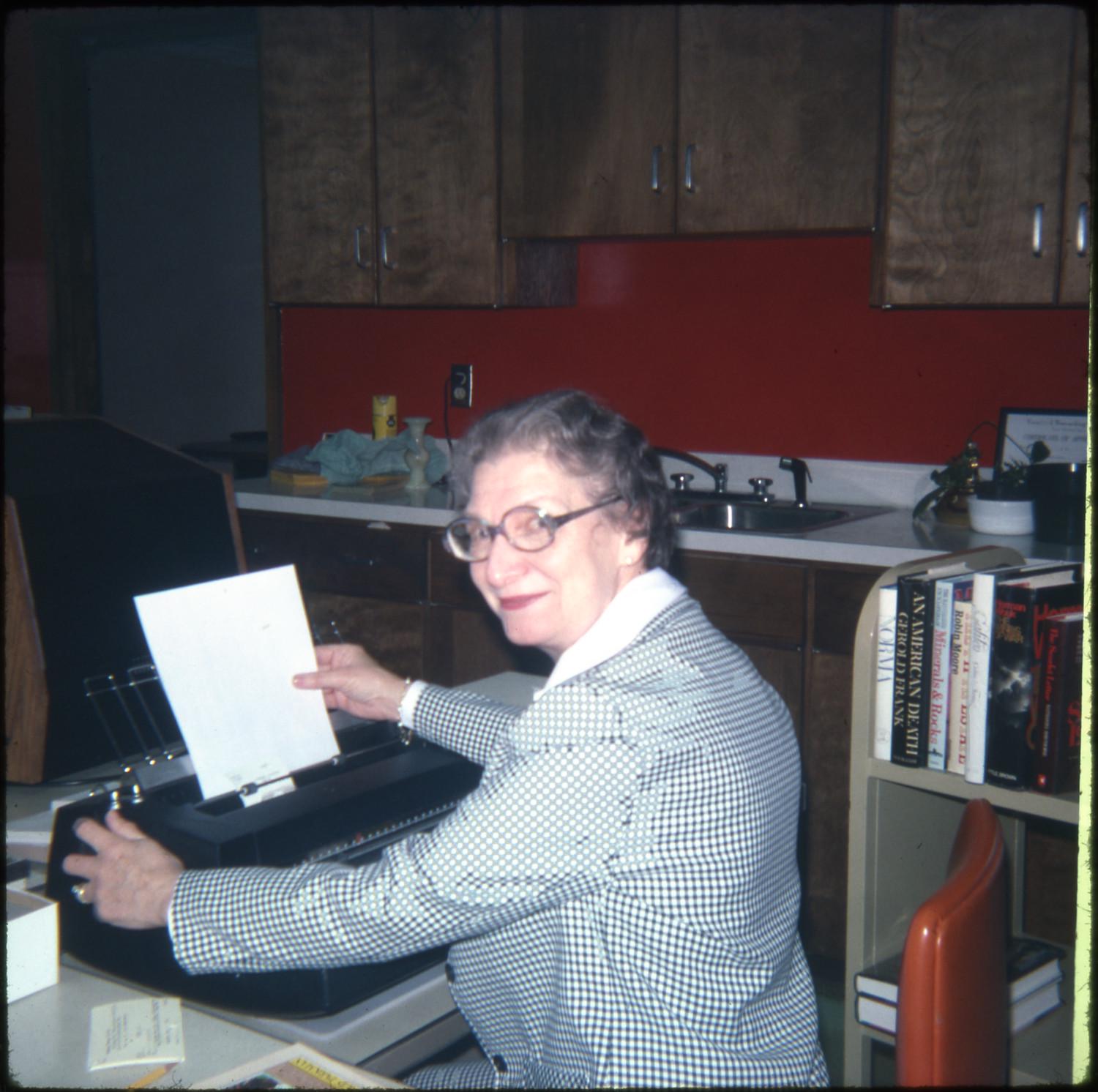 Library staff member types letters at the Marshall Public Library (Marshall, Texas) in 1978.

