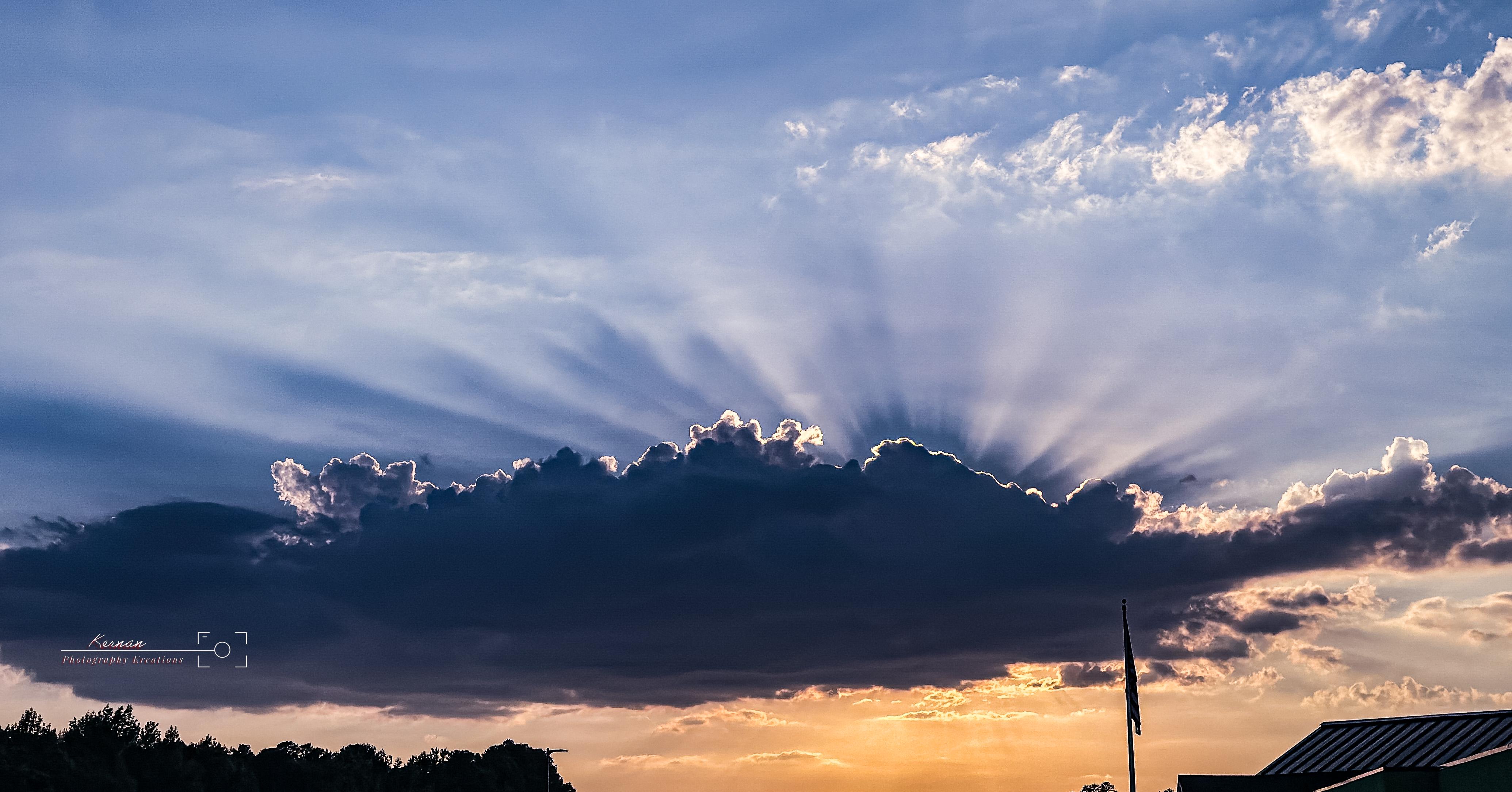 Look at the sun trying to show up behind this cloud. I love the contrasts of light between the over and under. What are your thoughts? 