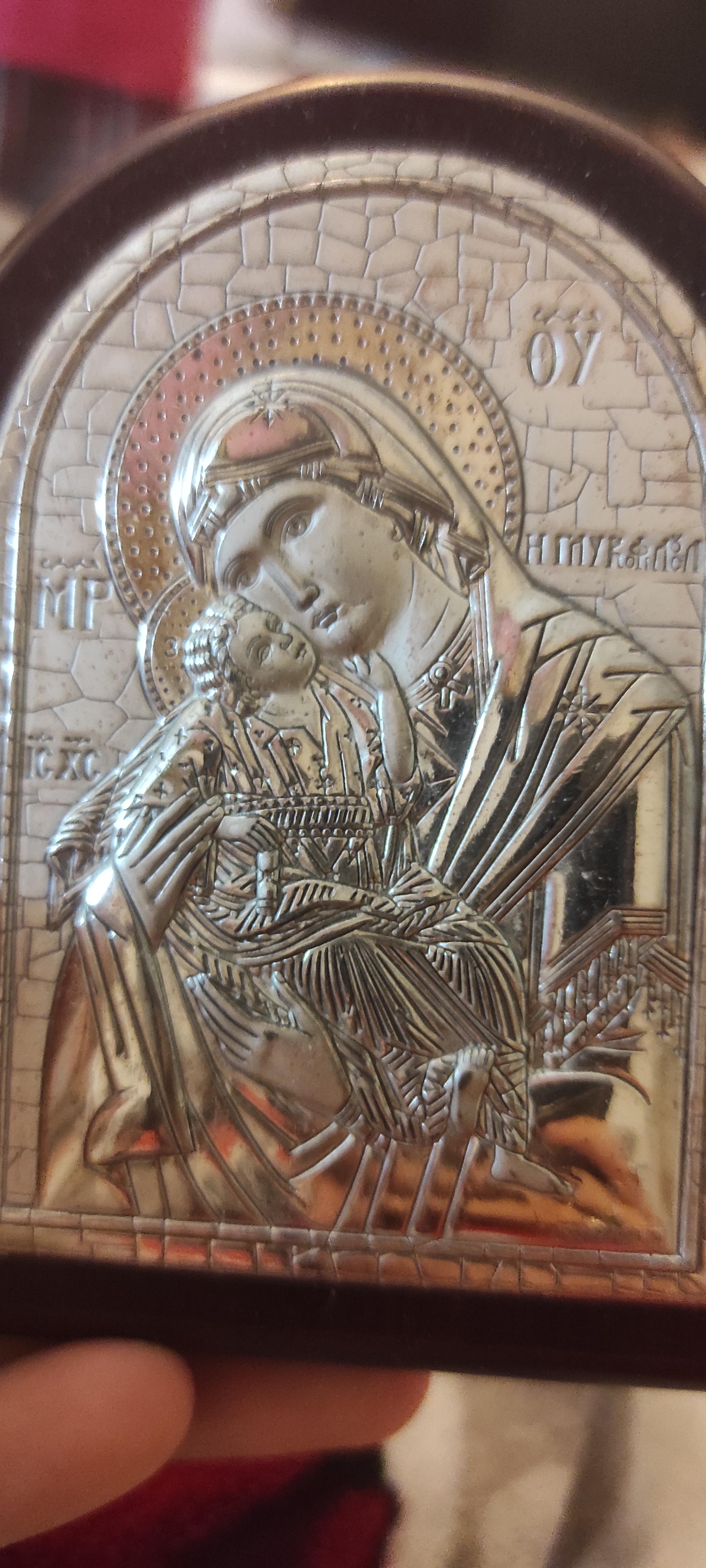 What's written next to mother Mary here? Thanks! | Scrolller