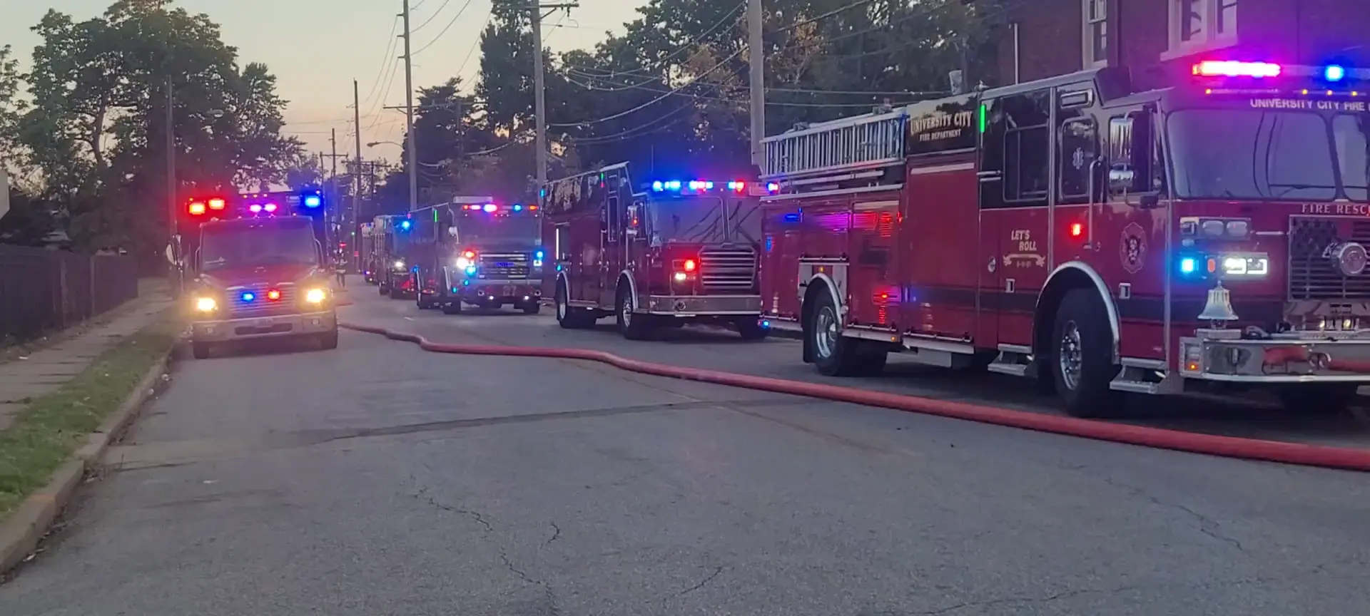 Multiple fire departments with police units on scene of a house fire in University City,Missouri 