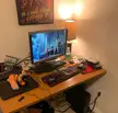 My meh setup. Laptop is main PC, and the PC in the corner is a file server made from e-waste parts (3TB disk from DVR and free PC)