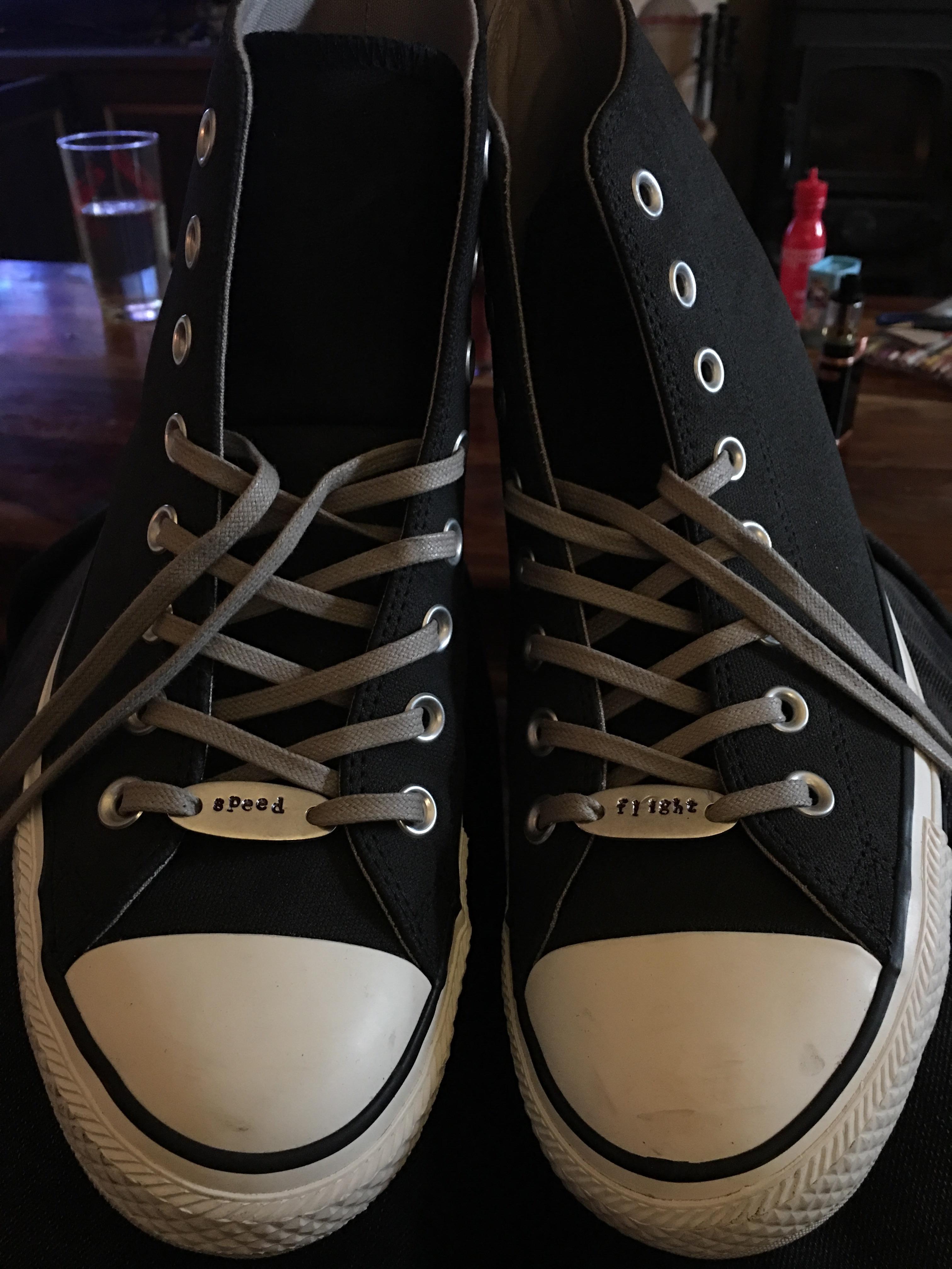 My shoes. Black Chuck Taylor All Stars. They bestow their wearer with ...