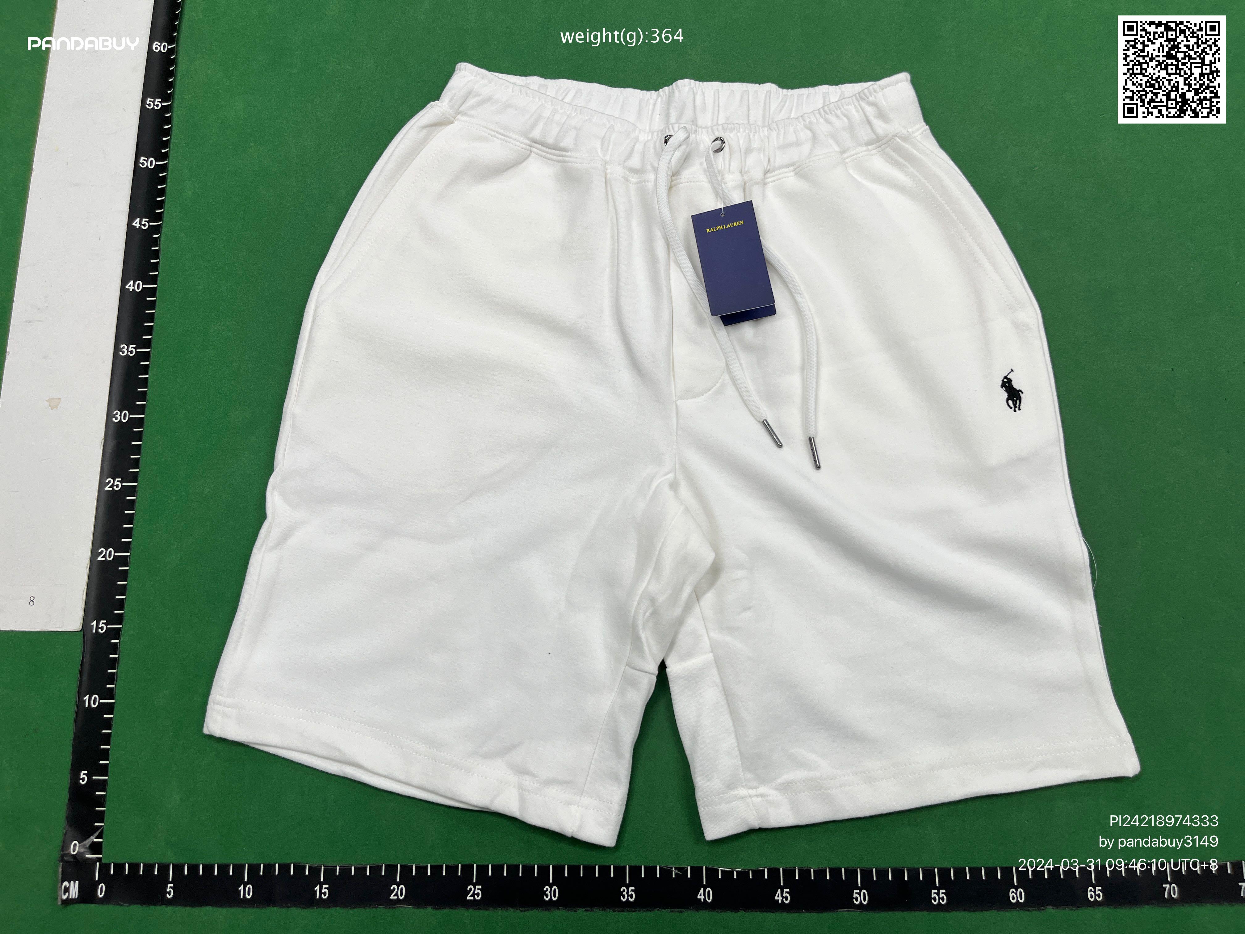 Pandabuy haul of streetwear including Gallery Dept, Spotify, and FC Barcelona shirts and sneakers on a green background