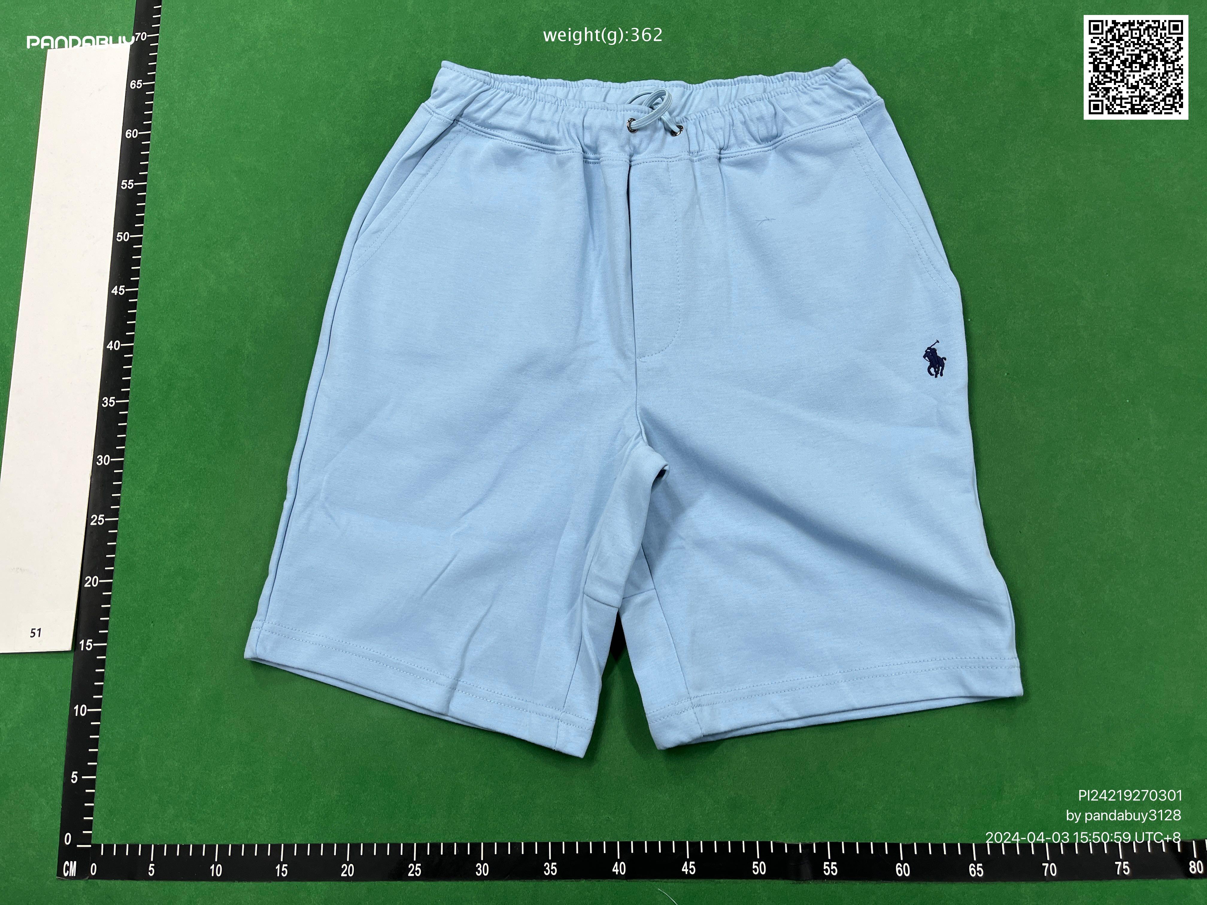 Pandabuy haul of streetwear including Gallery Dept, Spotify, and FC Barcelona shirts and sneakers on a green background