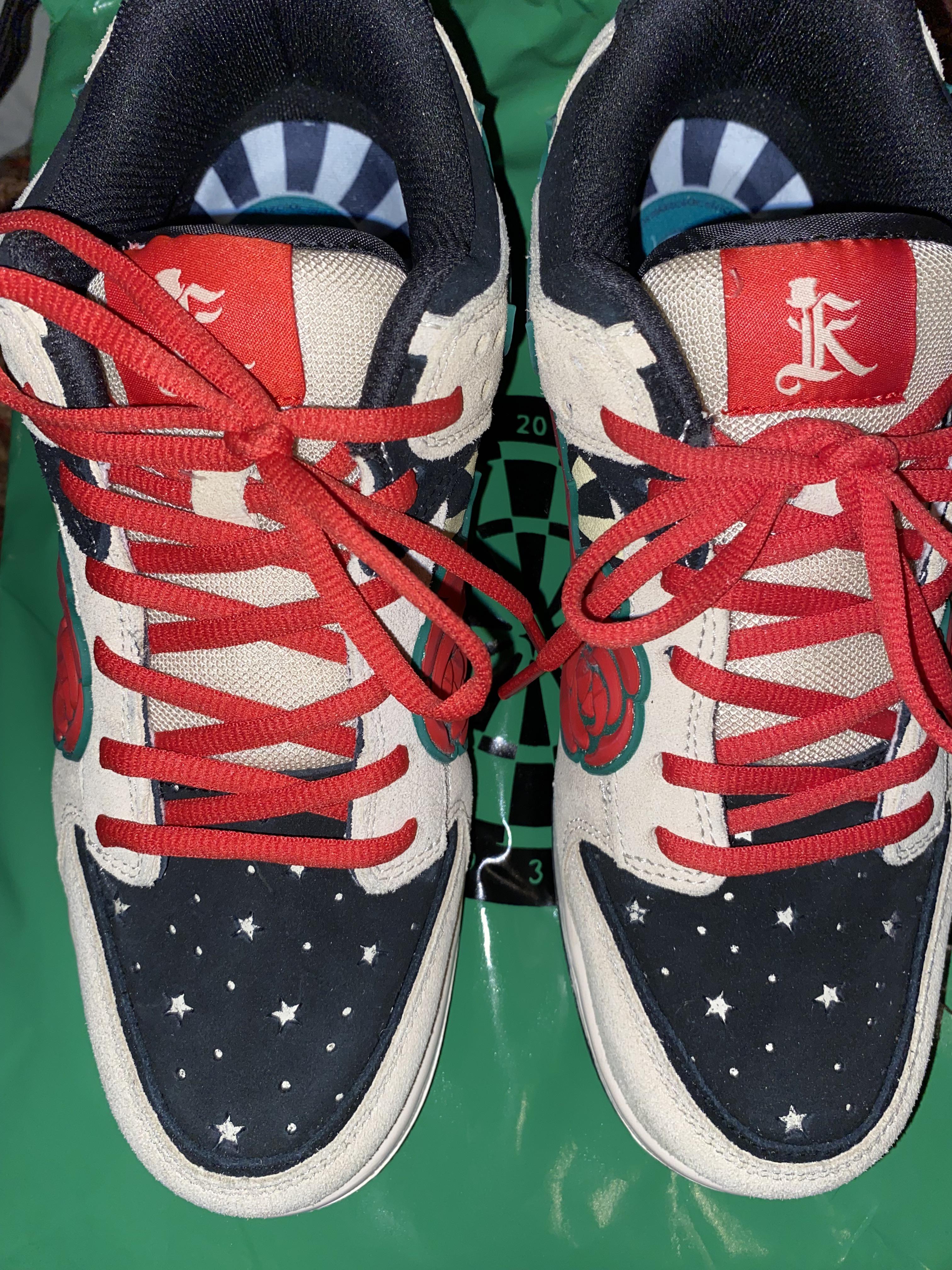 Close-up back view of KIZO sneakers on a green surface with a dartboard graphic.