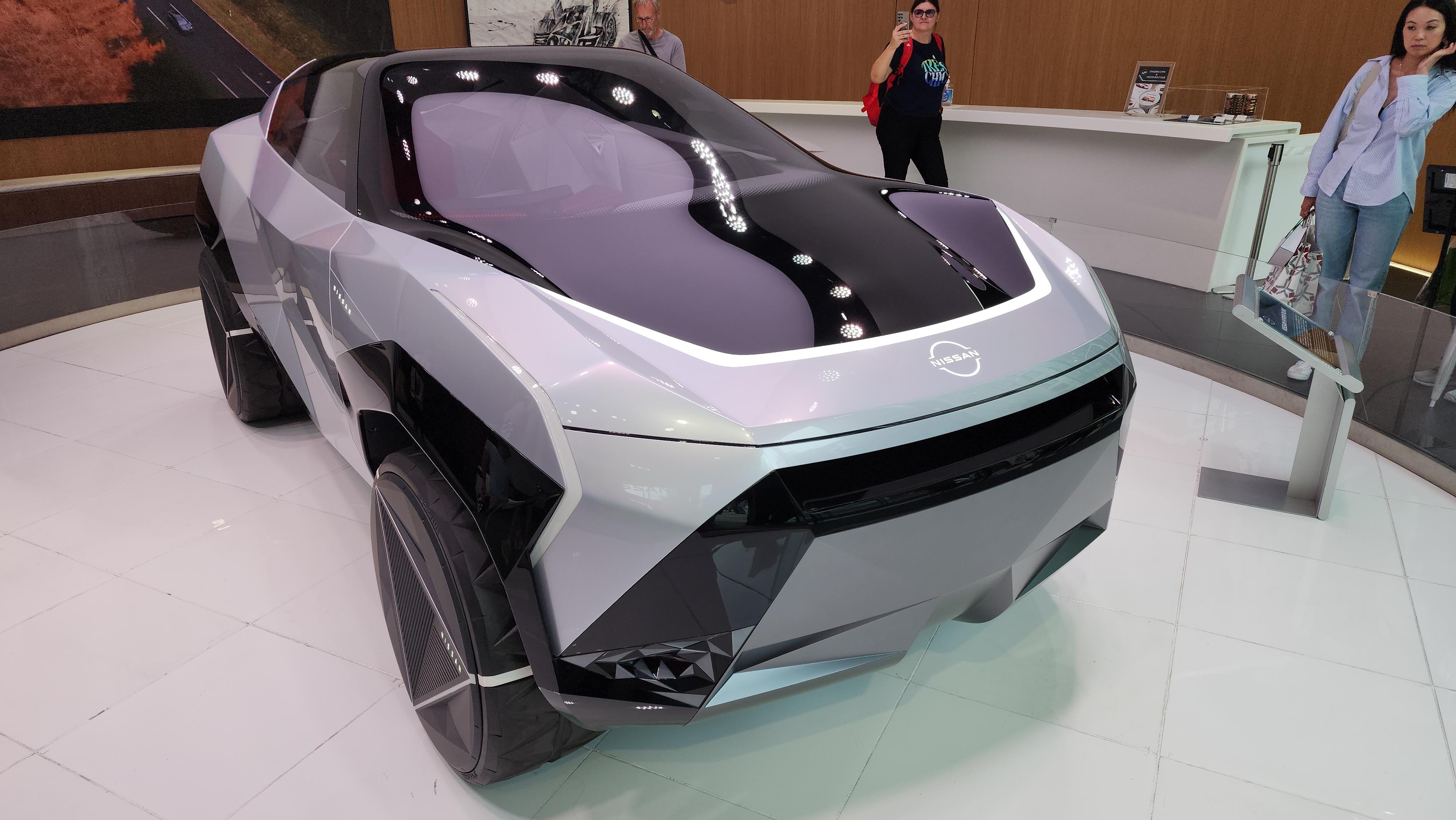 Nissan Cyber Punk concept car and interior at Nissan Crossing showroom with a group of people