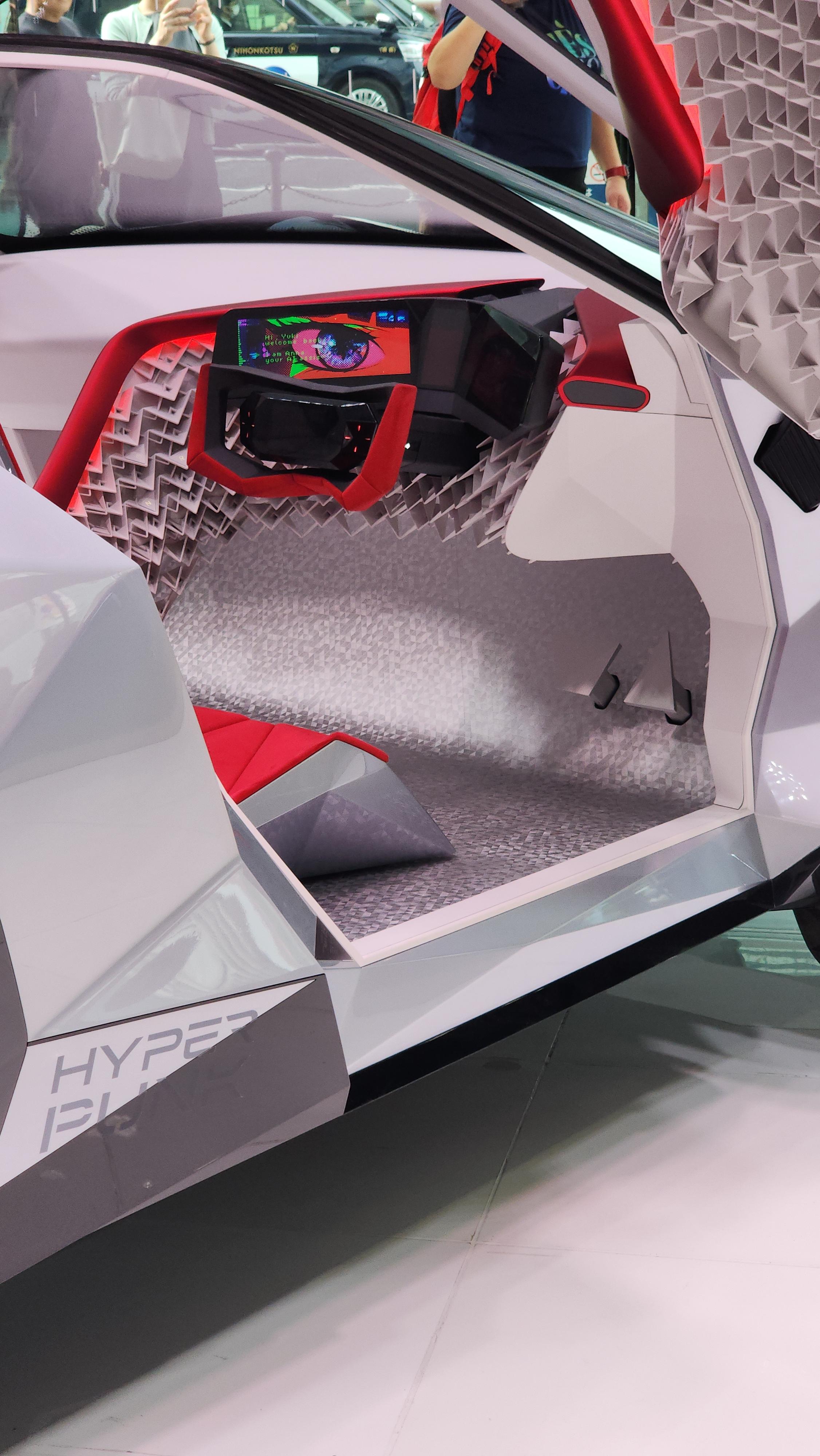 Nissan Cyber Punk concept car and interior at Nissan Crossing showroom with a group of people