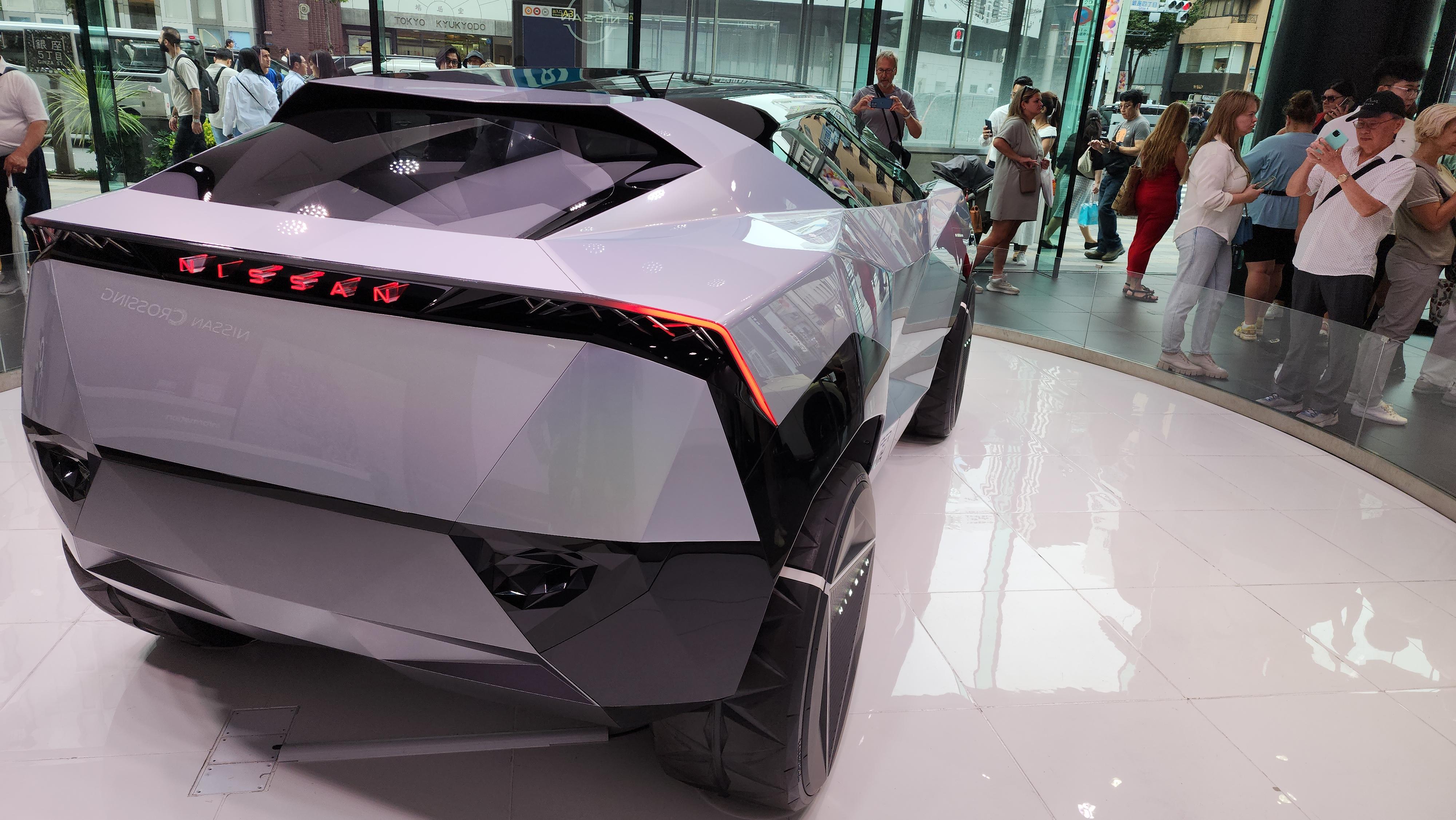 Nissan Cyber Punk concept car and interior at Nissan Crossing showroom with a group of people