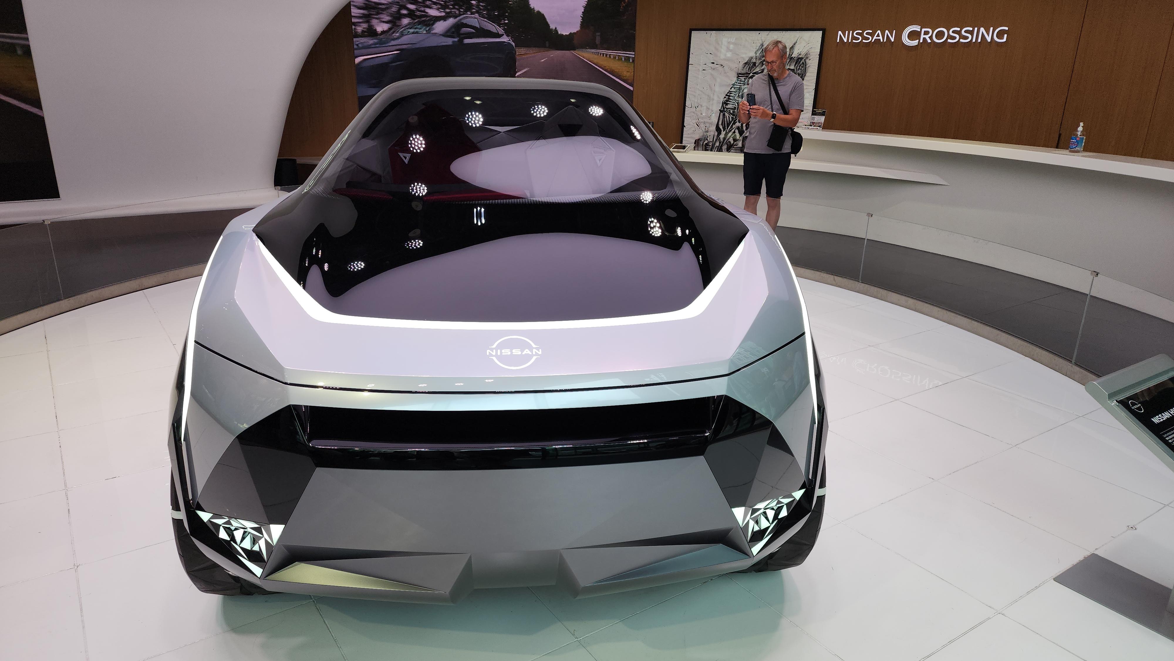 Nissan Cyber Punk concept car and interior at Nissan Crossing showroom with a group of people