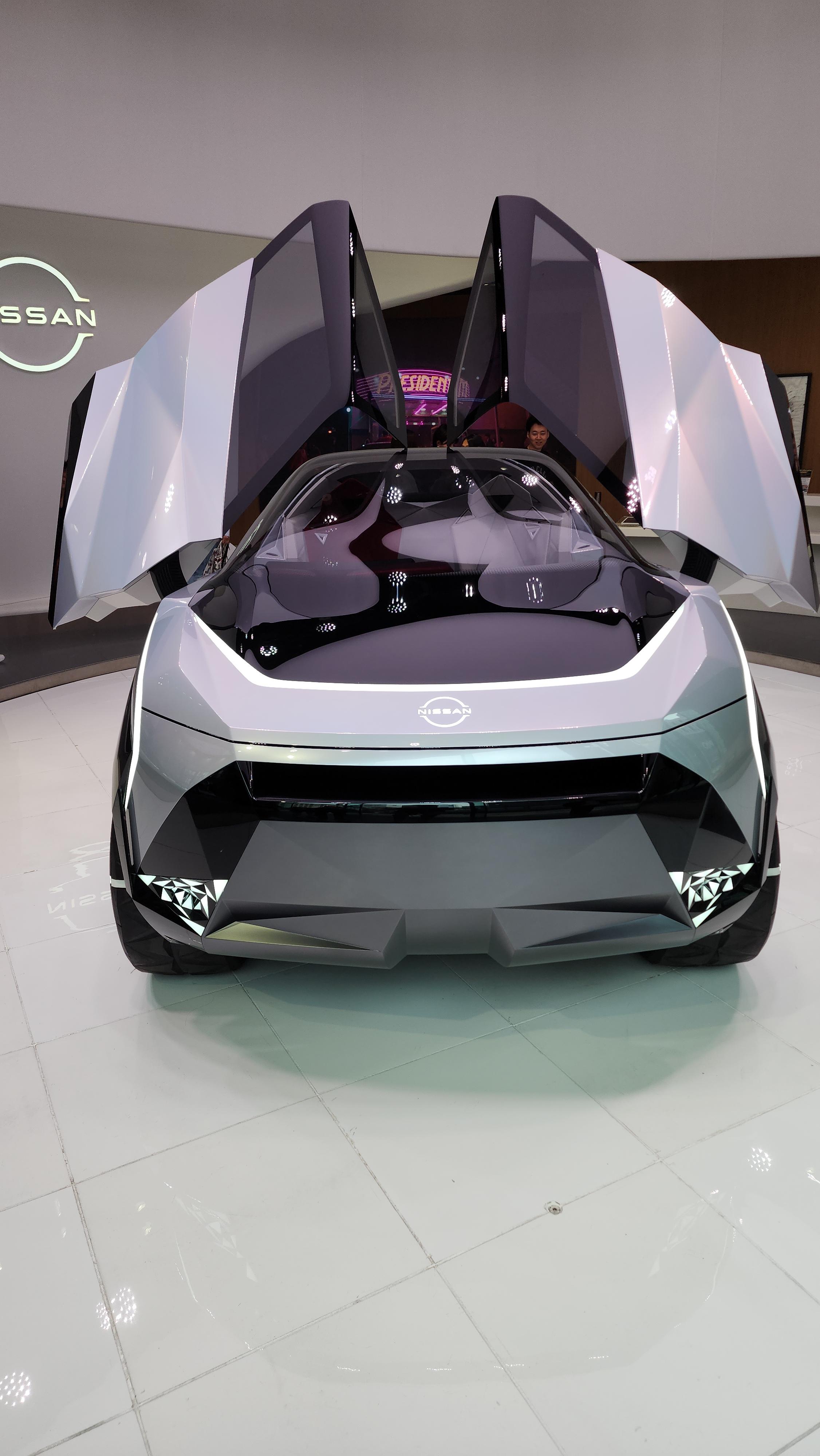 Nissan Cyber Punk concept car and interior at Nissan Crossing showroom with a group of people
