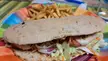 pita bread, burger, cheese, various vegetables and fries