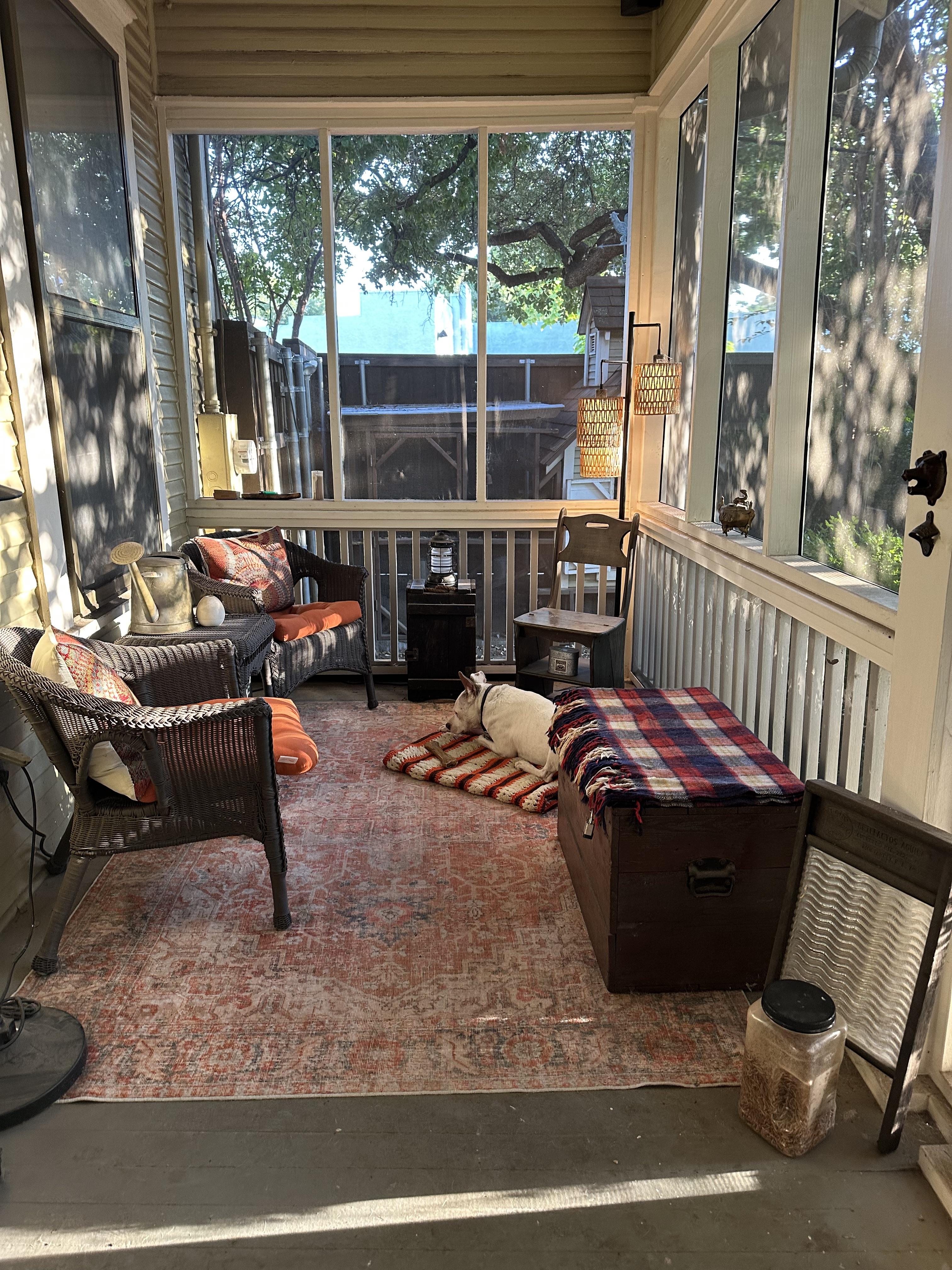 Male living space featuring a dining room, bedroom, living room, patio, sunroom, study, and a dog with oil painting art.