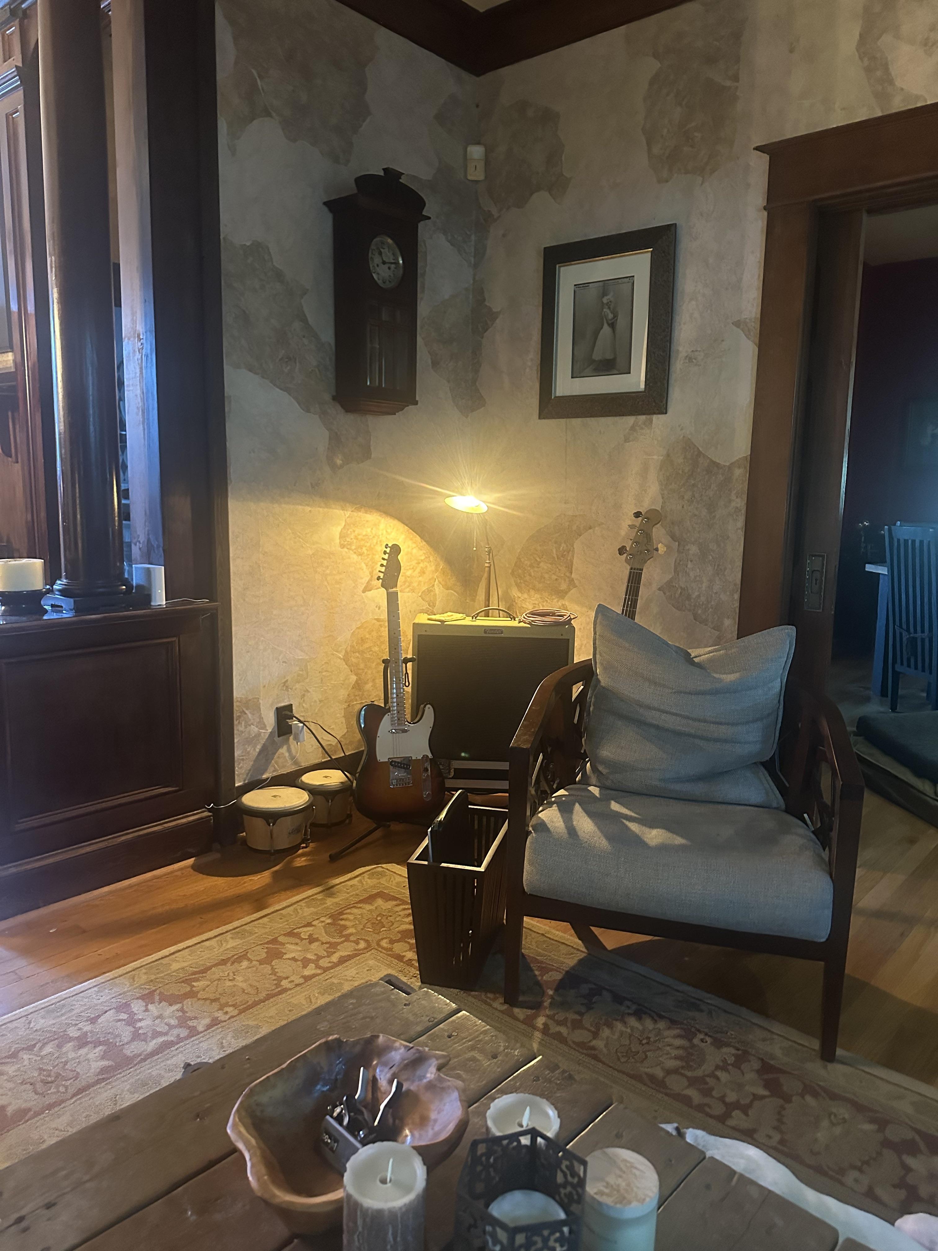 Male living space featuring a dining room, bedroom, living room, patio, sunroom, study, and a dog with oil painting art.