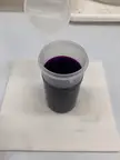 Potassium Permanganate solution (purple) being reduced by sodium chloride-hydroxyl ammonium chloride solution