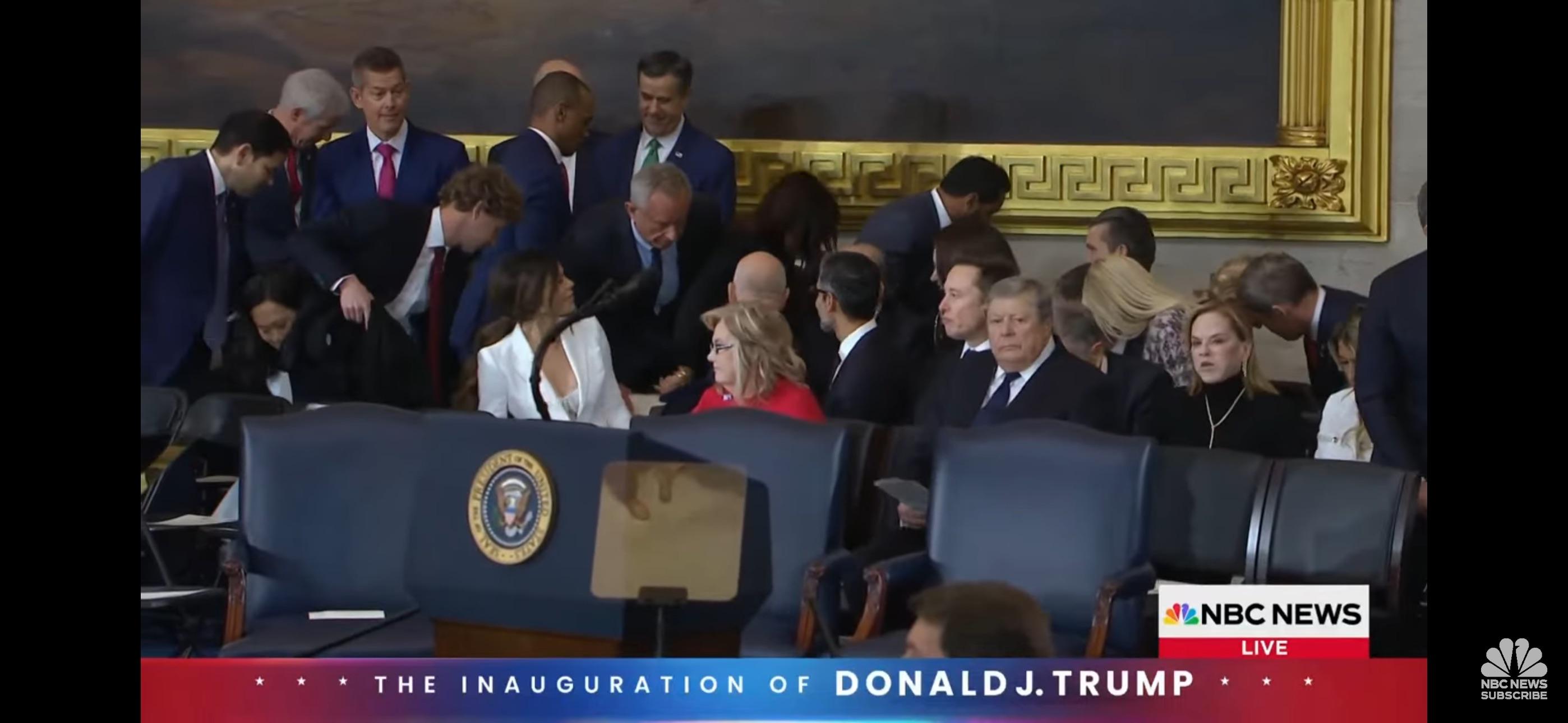 Celebrity couple in a white shirt and white dress attending the Trump Inauguration 2025