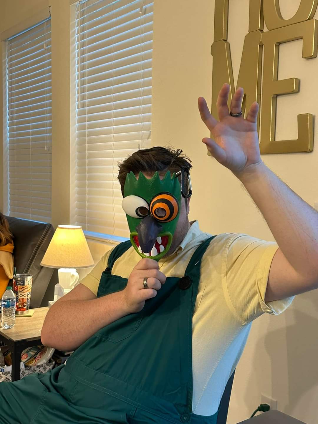 Courage the Cowardly Dog costumes featuring a person in a green monster mask and a person in a housewife costume