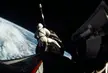 Real life space cowboy Dick Gordon straddles the nose of the Gemini spacecraft as he connects a tether to the Agena Target Docking Vehicle on Gemini XI [3000x2033]