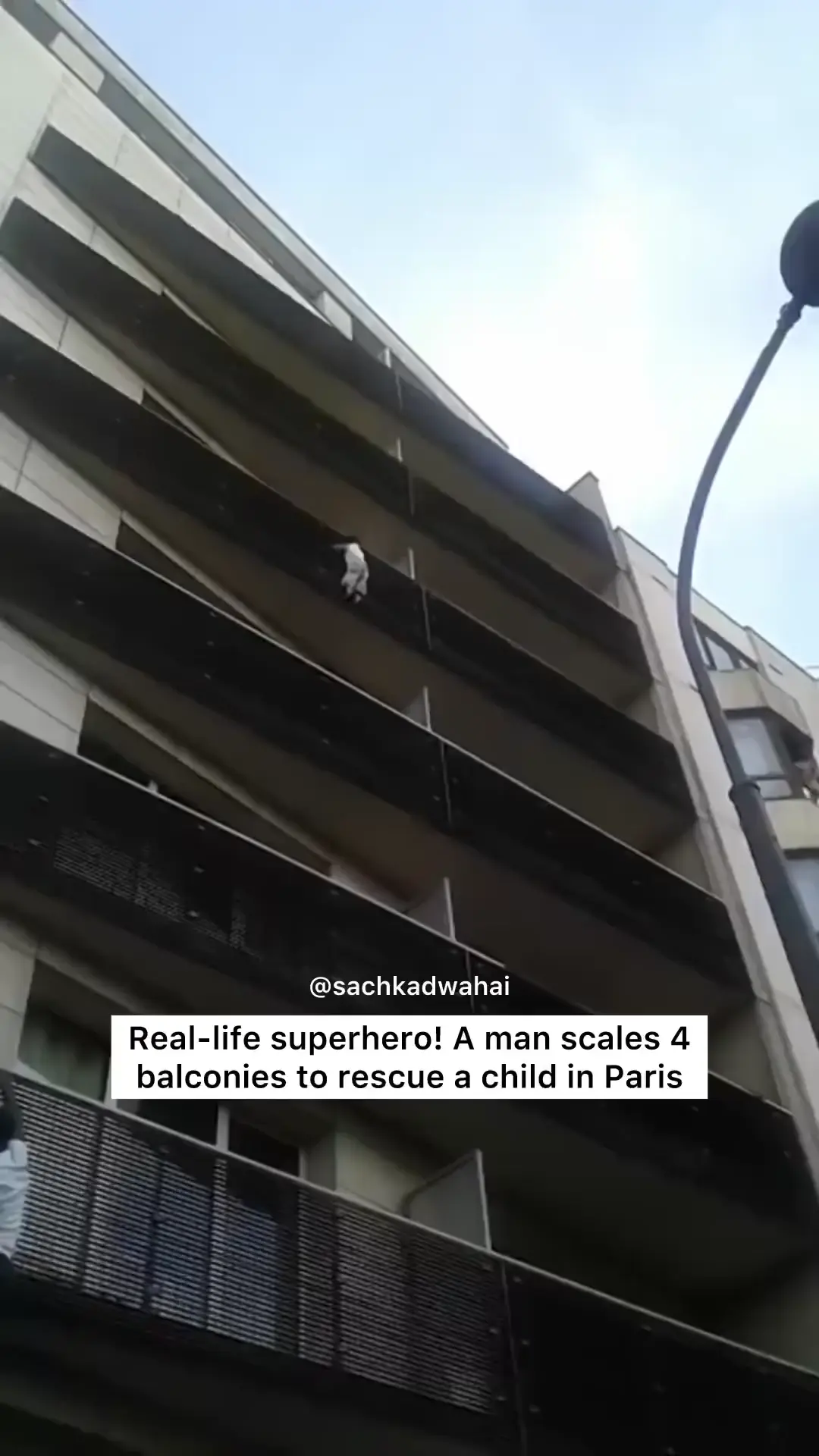 Real life superhero! A man scales balconies to rescue child in Paris.