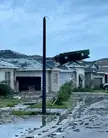 Roll off dumpster sitting on a roof in Palm Beach Gardens