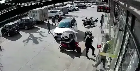 Runaway tyre heads straight for a security guard.